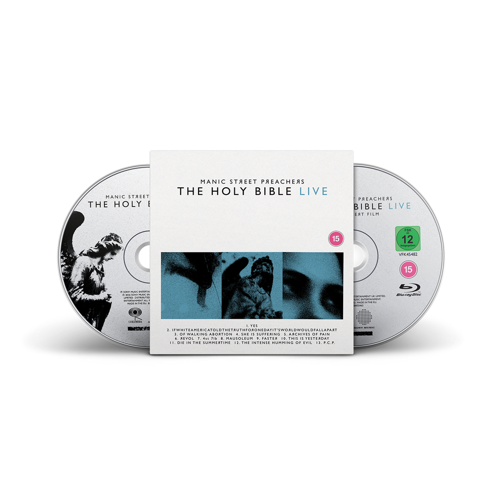 The Holy Bible Live 2-disc CD & Blu-ray set by Manic Street Preachers, featuring a white slipcover with blue and black imagery, flanked by one CD and one Blu-ray disc.